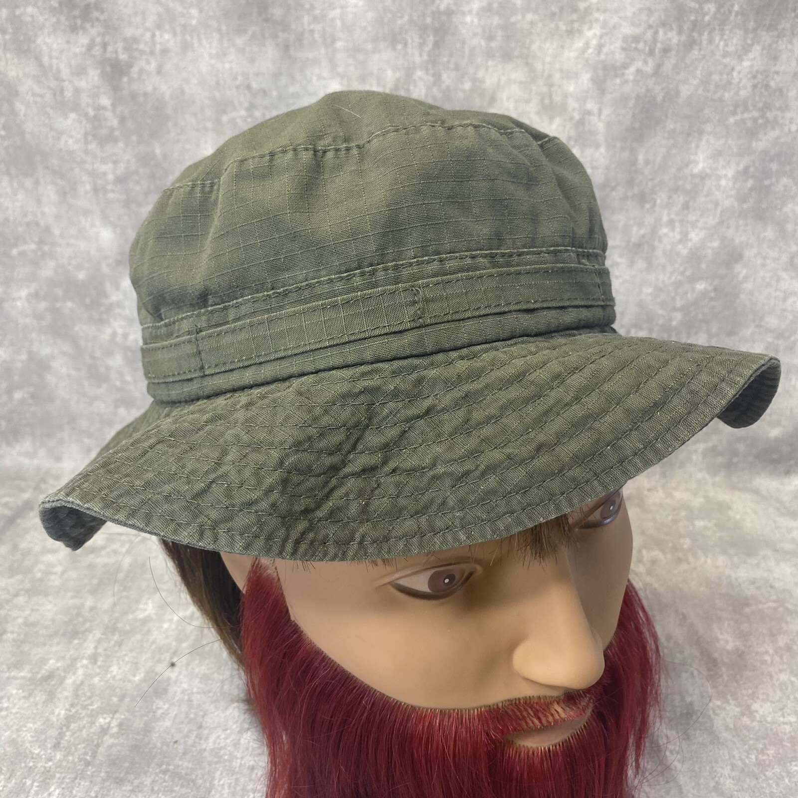 Distressed olive green medium bucket hat for casual style