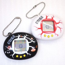 Dinosaur Virtual Pet Pishi KyoRyu Tamago Pair Lot of 2 Tamagotchi Giga Pets