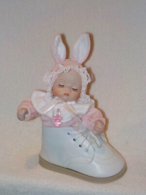 Porcelain Sleeping Baby Sitting In Baby Shoe Music Box (Hush Little Baby''