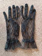 a pair of womens black sheer lace gloves size small