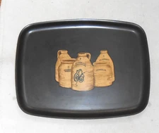 COUROC BLACK TRAY WITH JUGS AND "NORTON CO. WORCESTOR MA" PRINTED ON JUGS
