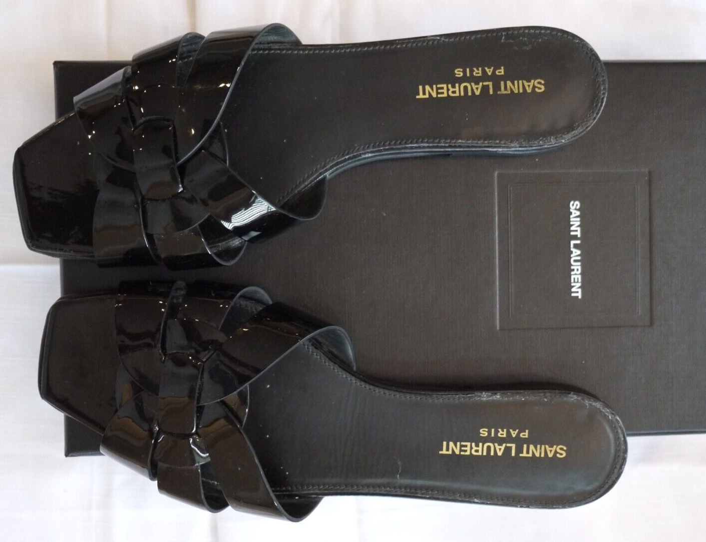 Diapositive brevetto tributo Saint Laurent