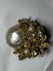 Vintage Miriam Haskell Signed Gold Tone Brooch Featuring A Large Faux Pearl