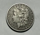 1890 CC TAILBAR MORGAN DOLLAR VF
