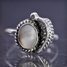 Size 4, southwestern sterling silver 925 ring with mother of pearl and feather