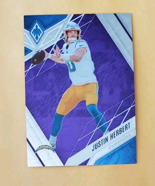 2022 Panini Phoenix Purple Lazer /99 Justin Herbert #49 SP