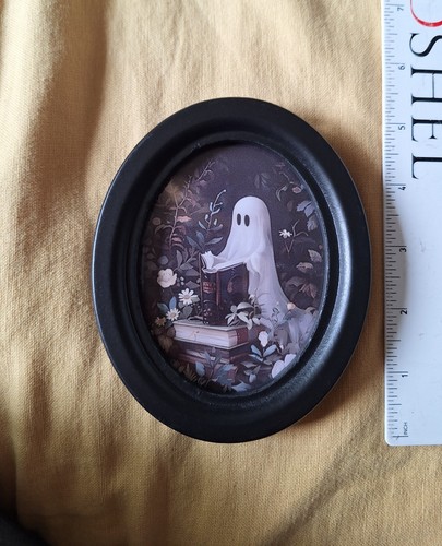 Ghost Reading In The Garden In Oval Ebonised Frame