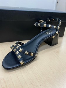 black heels with gold studs