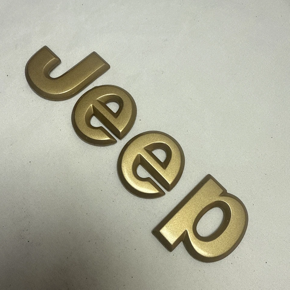 Jeep 1994-1997 Grand Cherokee emblema insignia logotipo color dorado capucha OEM 55155125 Foto 3 de 4
