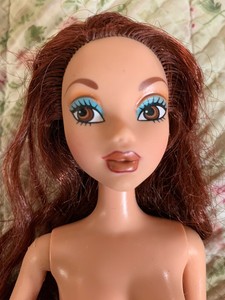 barbie doll with brown hair and brown eyes