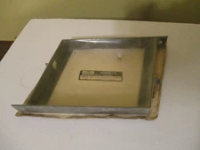 NOS 1970'S SKIROULE SNOWMOBILE BATTERY TOP HOLDER IN SEALED WRAPPER.