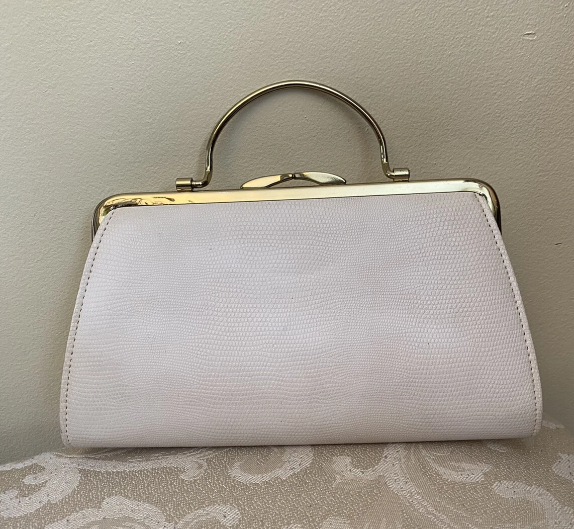 Clutch with outlet bracelet handle