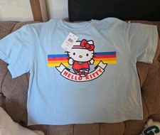 Hello Kitty Running Light Blue Tee with Retro Rainbow Stripe Graphic Size Large