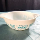 Vintage Pyrex Cinderella mixing bowl in the turquoise "Amish Butterprint"