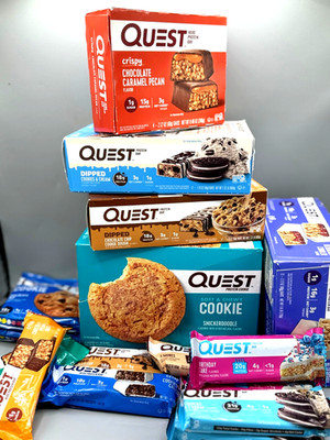 65 ASSORTED QUEST PROTEIN BARS/COOKIES/CAKES/MUFFINS/HERO/CANDIES