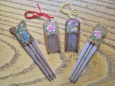 A set of 4 Wooden Painted Chinese Hair Dressing Combs and Pins