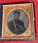 Daguerreotype -  Civil War Soldier with Sword & Pistol, Approx. 3 1/8" x 3 1/2"