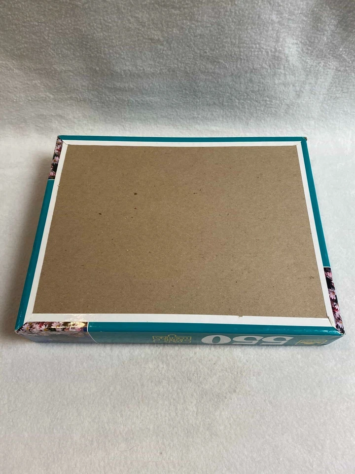 Rompecabezas dorado - 550 piezas - Yorkshire Terrier perro en cesta de flores Foto 2 de 4