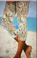 Women  s large Capri length printed Capri elastic waist. Sand/White