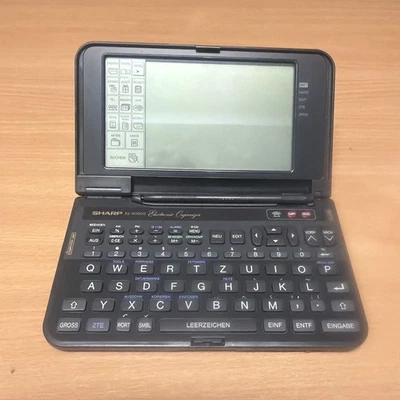 Sharp IQ-9000G PDA Electronic Organiser w/ Keyboard & Stylus (GERMAN) - Image 1 of 3
