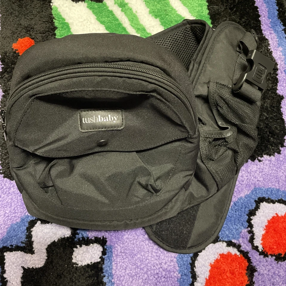 Portabebés TUSHBABY Asiento de Cadera Sin Tirantes Ajustable con Bolsillos Suavemente Usado Foto 2 de 4