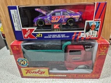 Die Cast vehicles, K Mart race car bank and tonka Dump truck, NIB