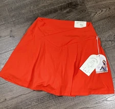 BLogilates Womens Crisscross Spicy Orange Slid Skort Size M Pockets Gymwear NEW