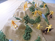 12 Marx Cowboys will be yellow  Brown 1/32nd figures  Mar.Listing 