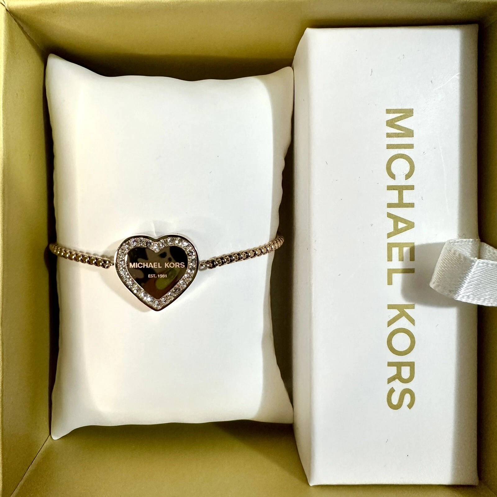 Michael Kors Bracciale cursore con logo cuore Heritage oro rosa