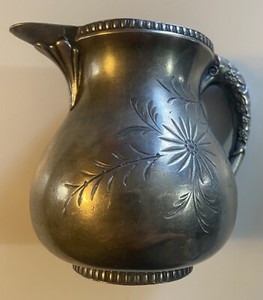 ornate miniature antique pitcher