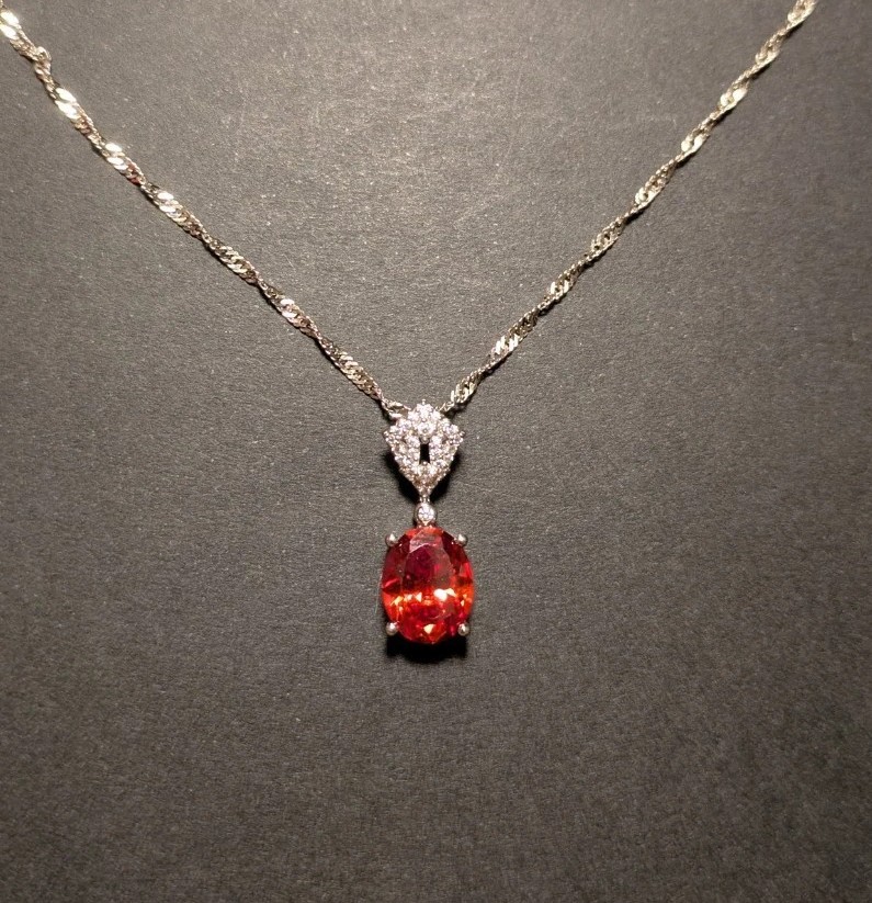 Ornate Orange Oval Gemstone Pendant  With Silver Spiral Chain Never Worn