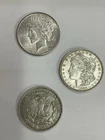 Lot of 3 - 90% Silver Dollars: 1927 Peace AU, 2-1921 Morgan’s .77344 Oz in Each