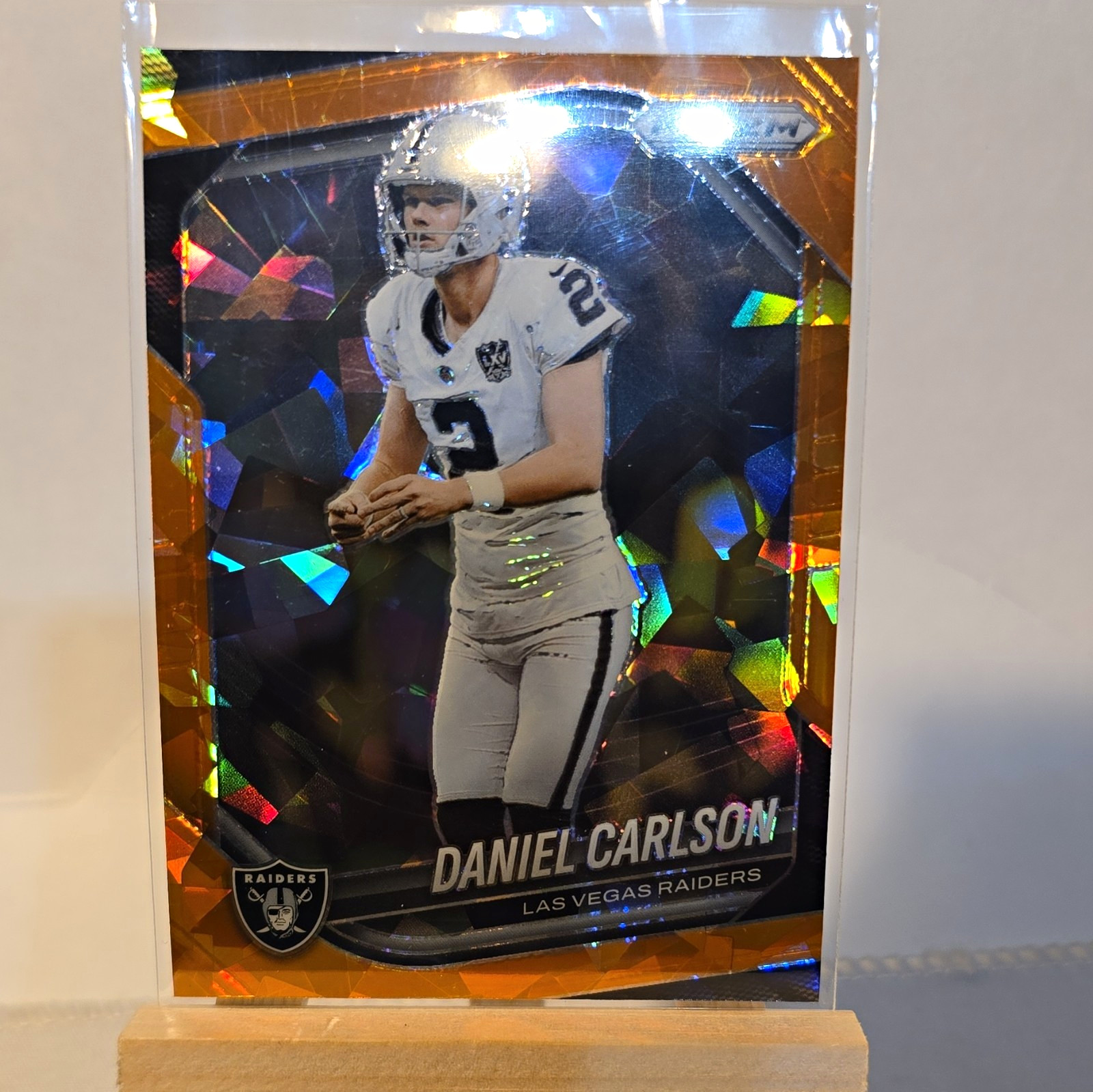Panini 2025 Prizm Daniel Carlson Raiders #271 Orange Ice Prizm Parallel