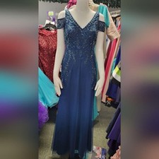 This stunning Adrianna Papell formal gown in a rich blue hue with cold shoulder