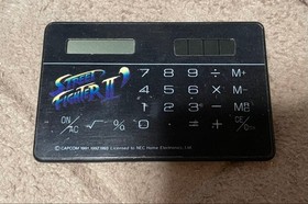 Naughty Boy, Promotional item, Street Fighter II' Hu Card design, Calculator