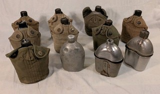 Lot of 11 U.S. Military GI Canteens WWII 8 w/ Covers And Cups 1 w/ Trench Art