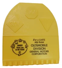 Vintage Oldsmobile Division GM Corp. Ice Scraper Yellow Clip Back Plastic Unused