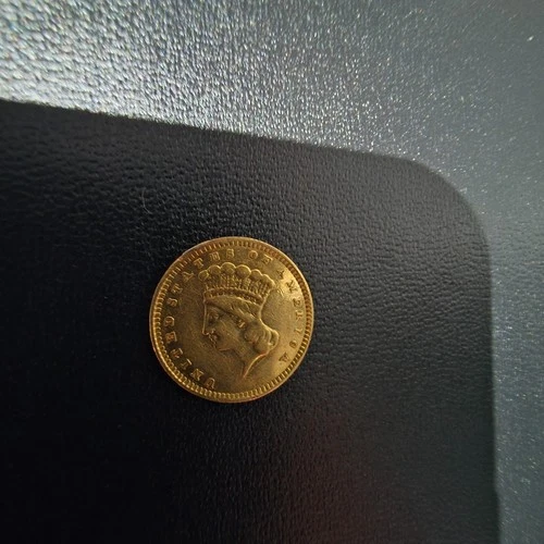 1857 $1 gold liberty.
