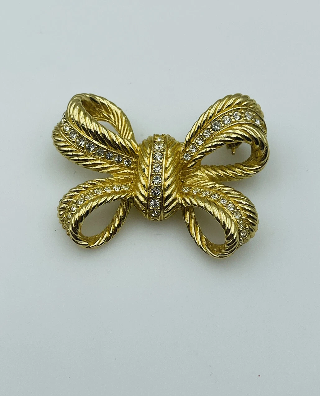 Christian Dior spilla fiocco strass trasparenti placcata oro vintage