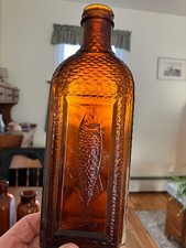 Cod Liver Oil Bottle with Pictorial Embossed Fish and Scales