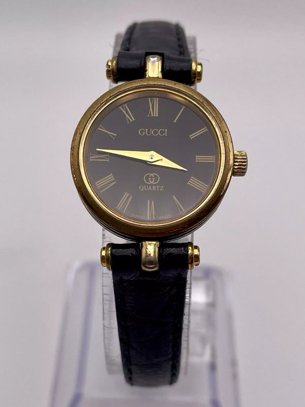 Montre femme GUCCI bracelet cuir noir ton or pile neuve