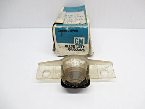 NOS 1985 REAR LICENSE PLATE LAMP MAY FIT OTHER YEARS GM# 912345 PONTIAC GM CADIL