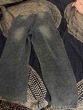 Wide-Leg Denim Jeans with Distressed Details