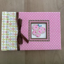 Baby Brag photo album. Pink with butterfly design. 6 x 4 . Holds 20 photos. New