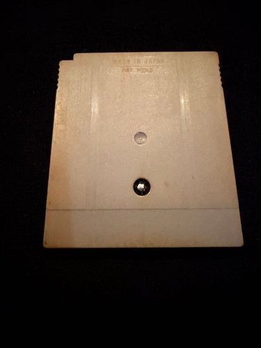 White Nintendo Game Boy GB cartridge with dual horizontal label, black screw hole, and visible “Masakari Densetsu Kintarou” text.