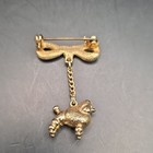 Vintage Gold Tone Metal Bow Brooch Pin Dangle Poodle Charm Animal Theme No Stone — photo 4