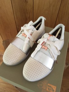 women's white and rose gold trainers