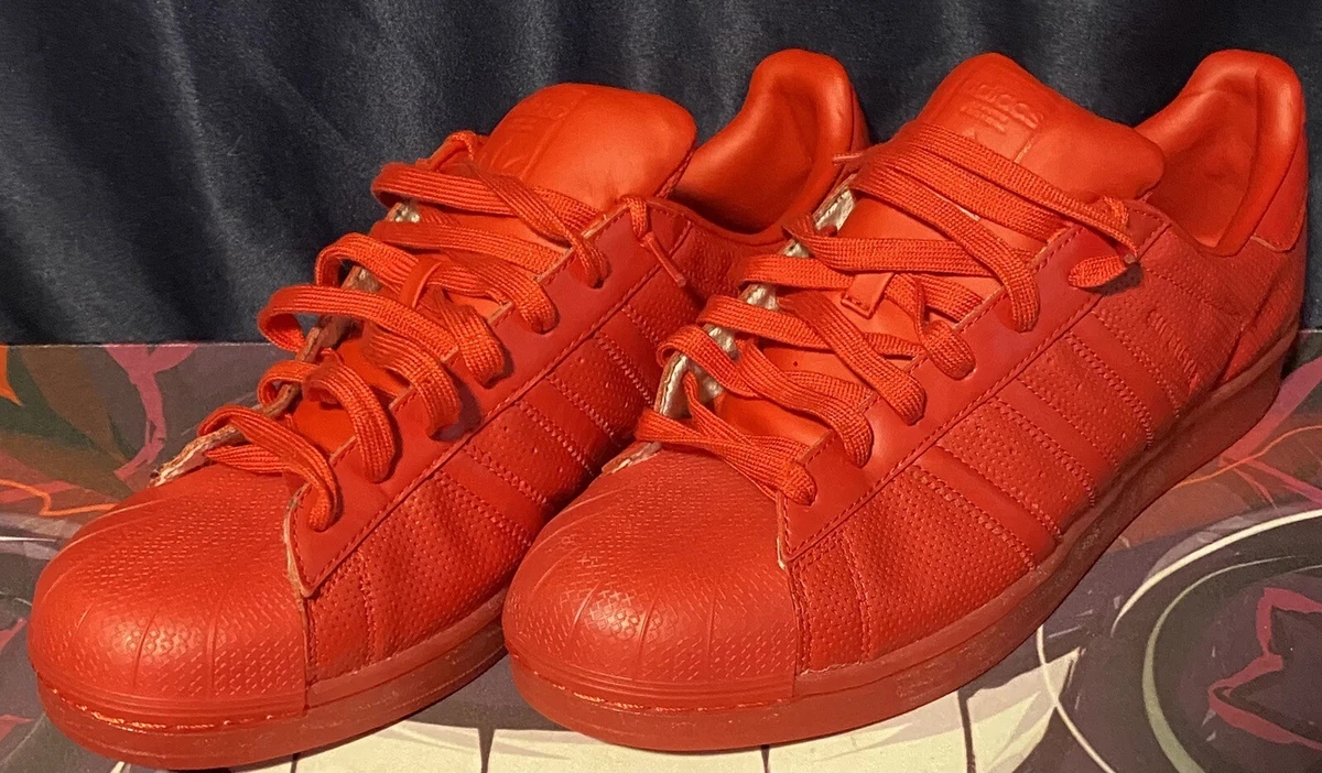 Solid red adidas sales