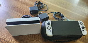 Nintendo Switch OLED Console Bundle.  Games, docking station and case