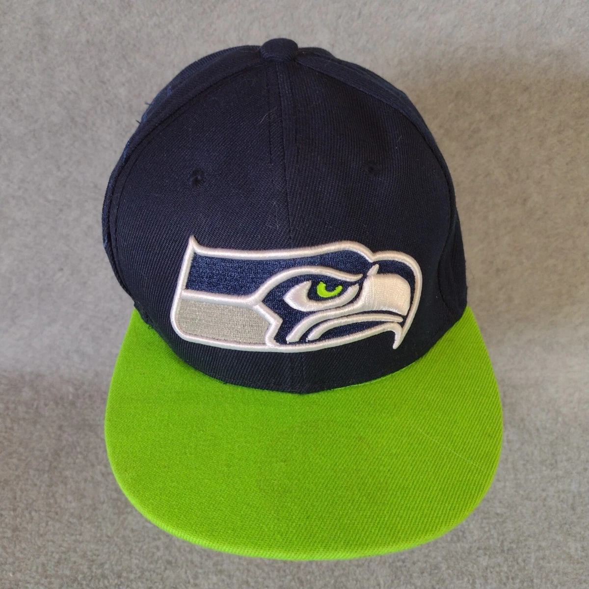 Hat with writing under bill 2025